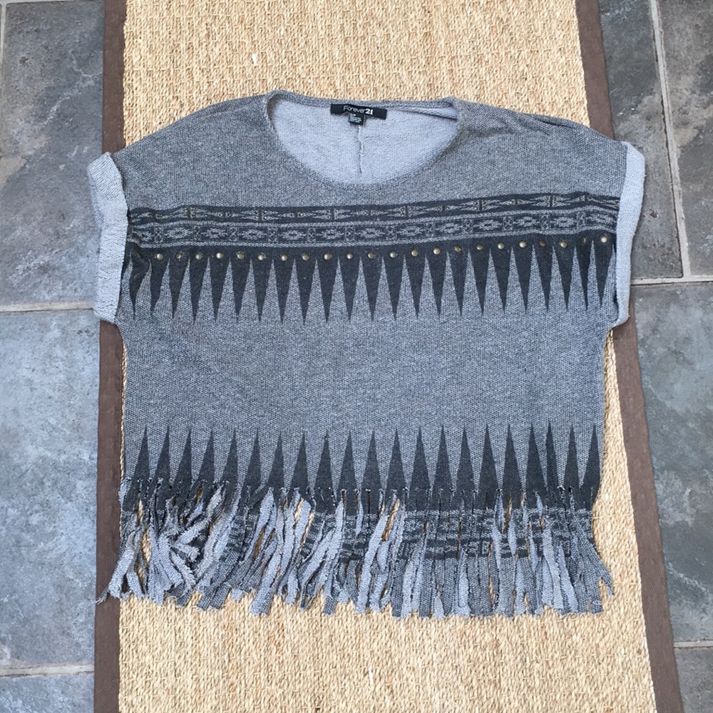 Gray top with fringe bottom.
